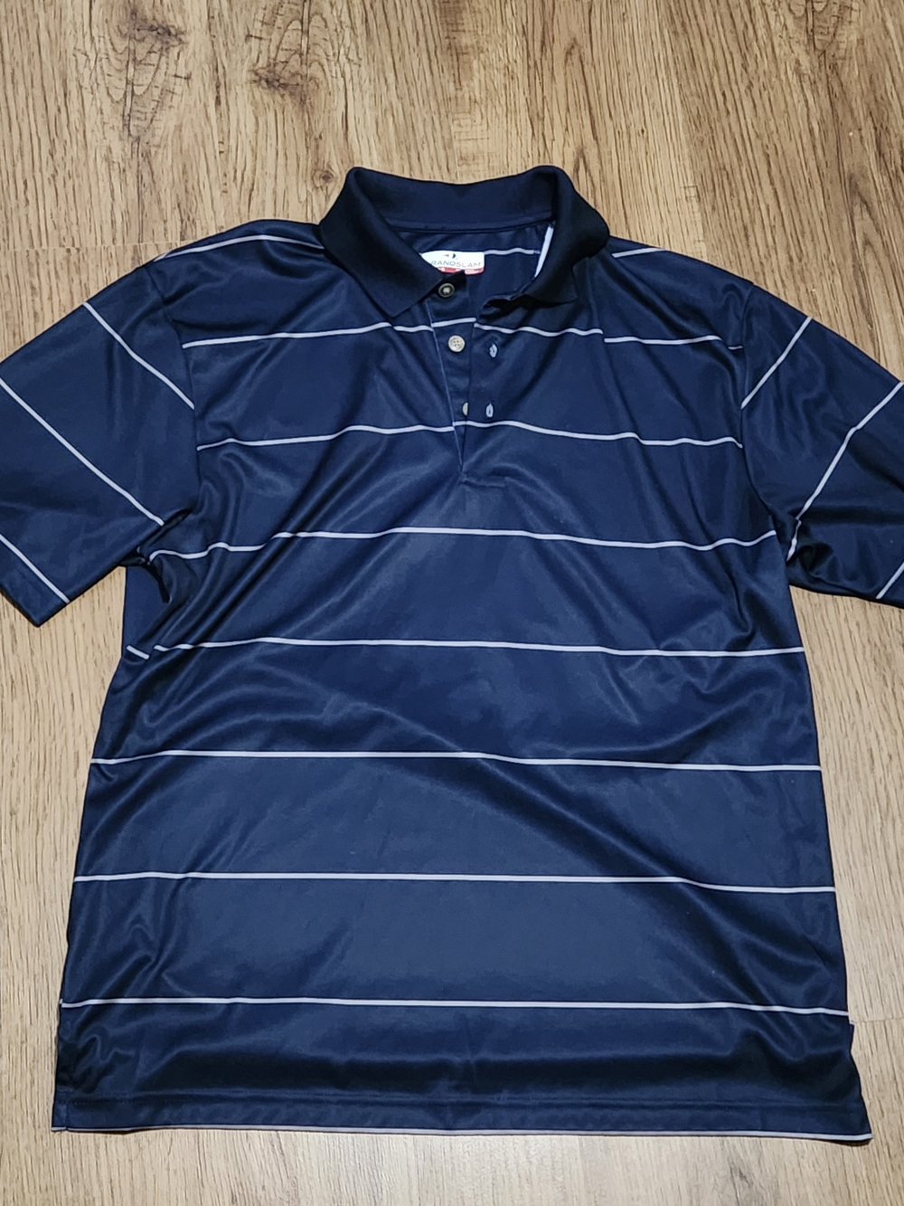 Grand Slam Navy Polo with Thin White Stripes